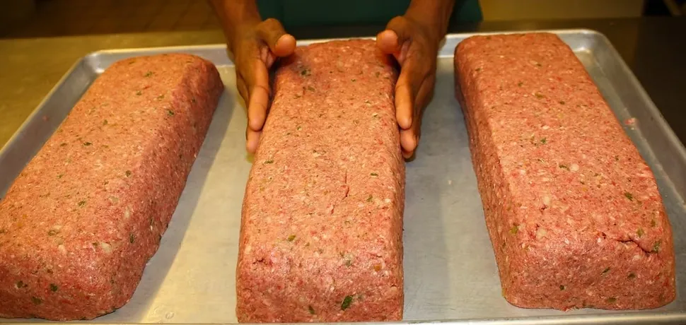 Scratch-made meatloaves shaped by hand for a catering order